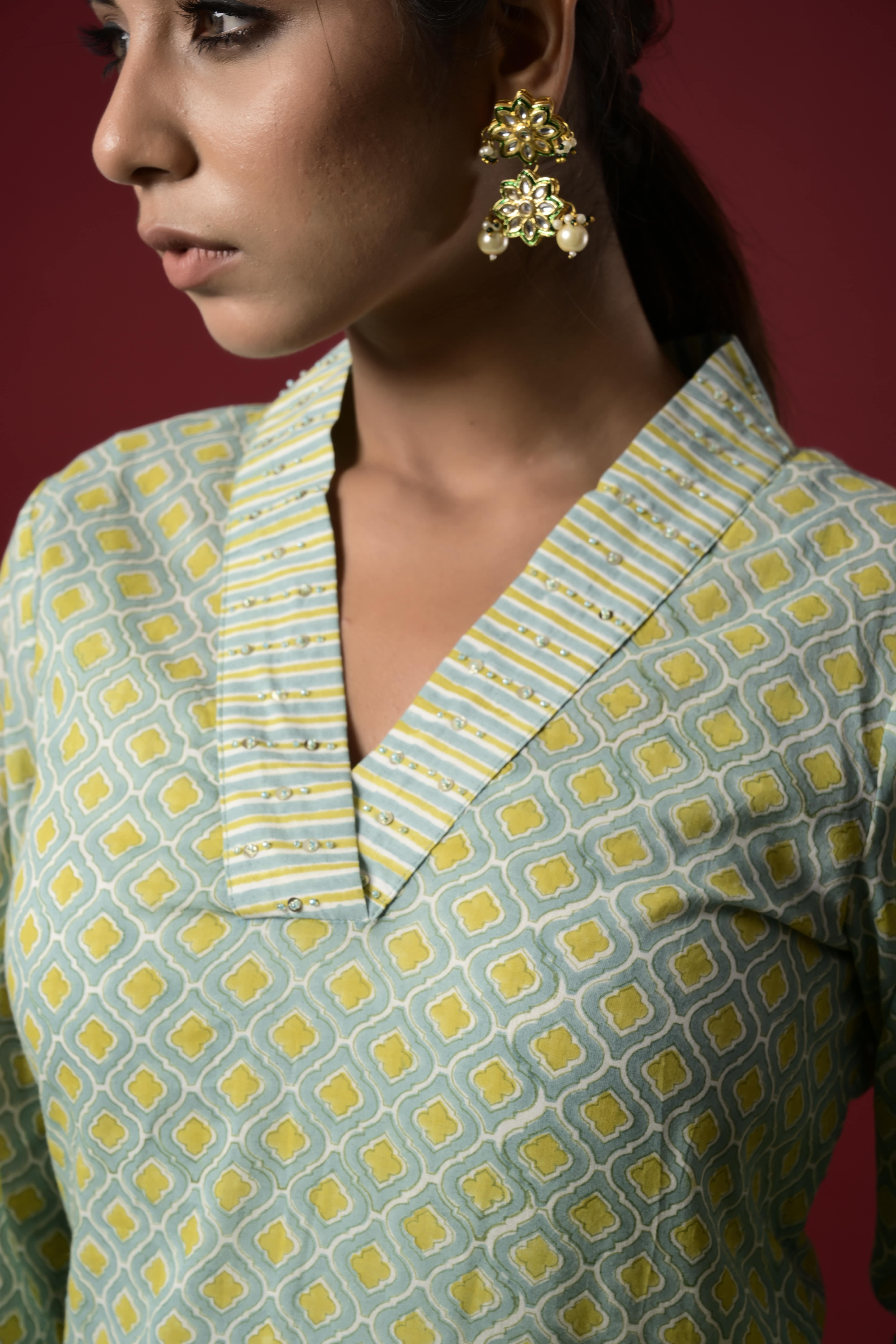 Block printed v- neck straight fit kurta with pant and kota doria shaded dupatta with tassels and with a little embellishment on collar and cuffs