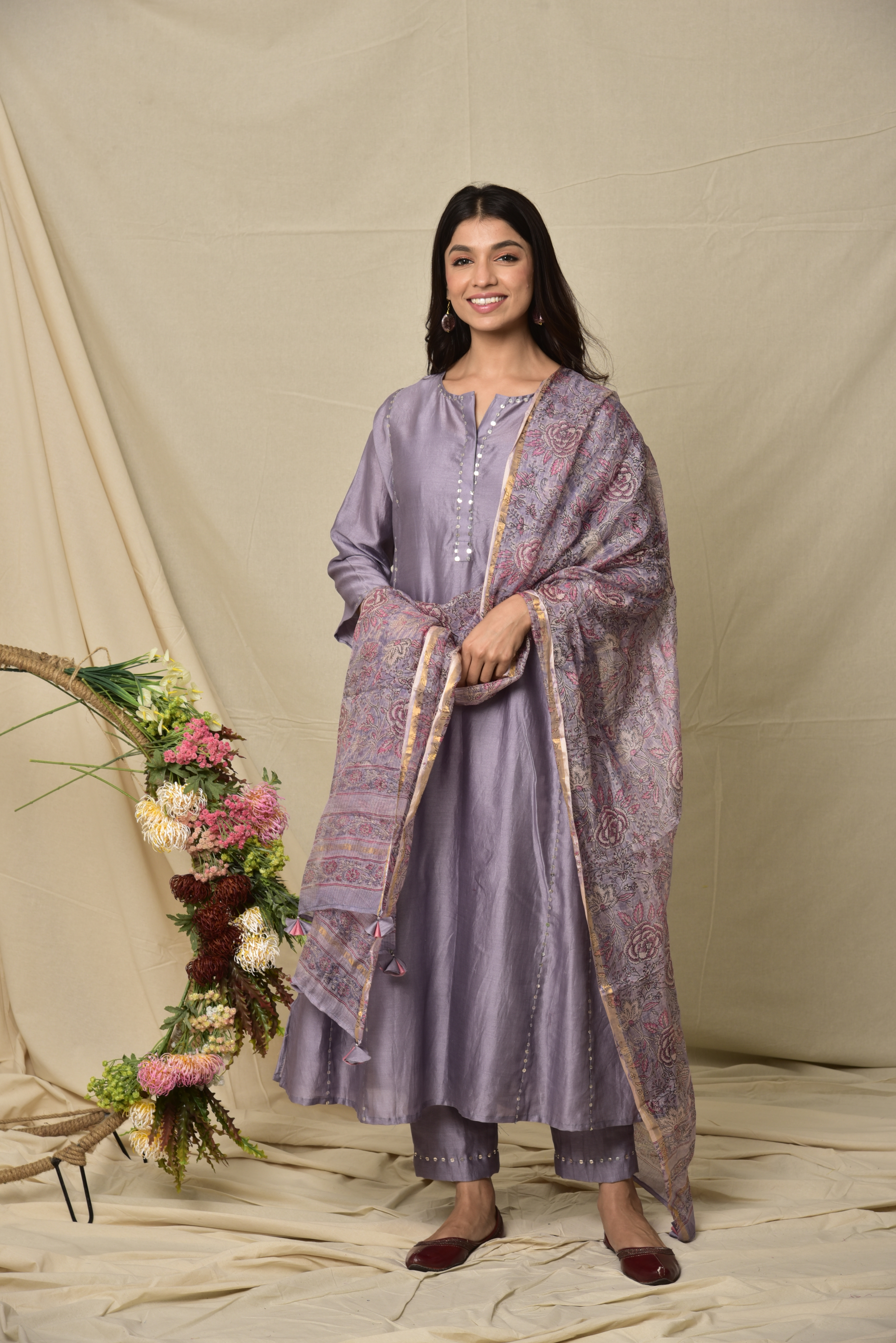 Purple thick chanderi panelled kurta with sequence work all over and comes with a kota silk printed dupatta with sequence work