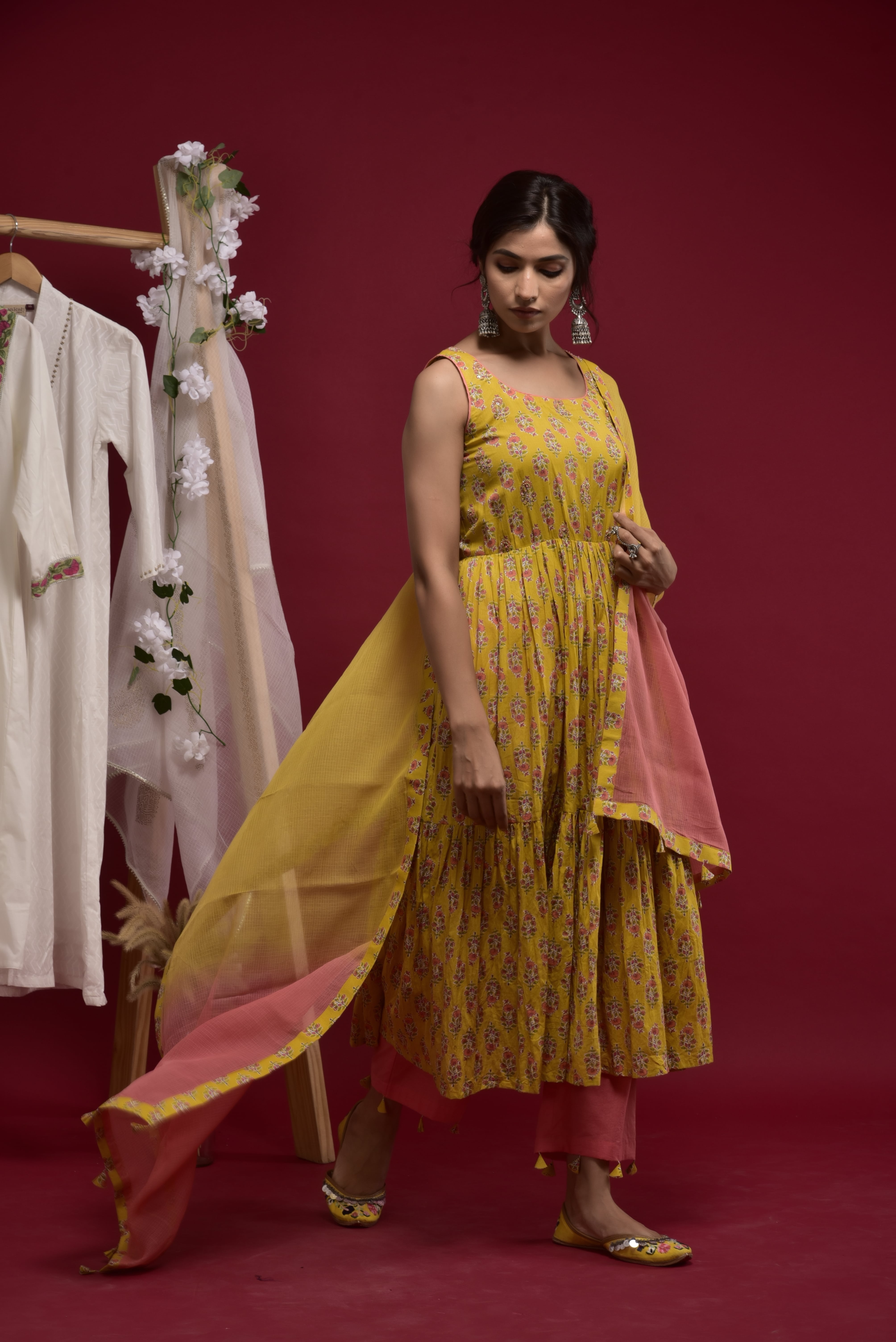 Yellow printed tiered kurta with highligthed yoke & pant and kota doria shaded dupatta with fabric tassels