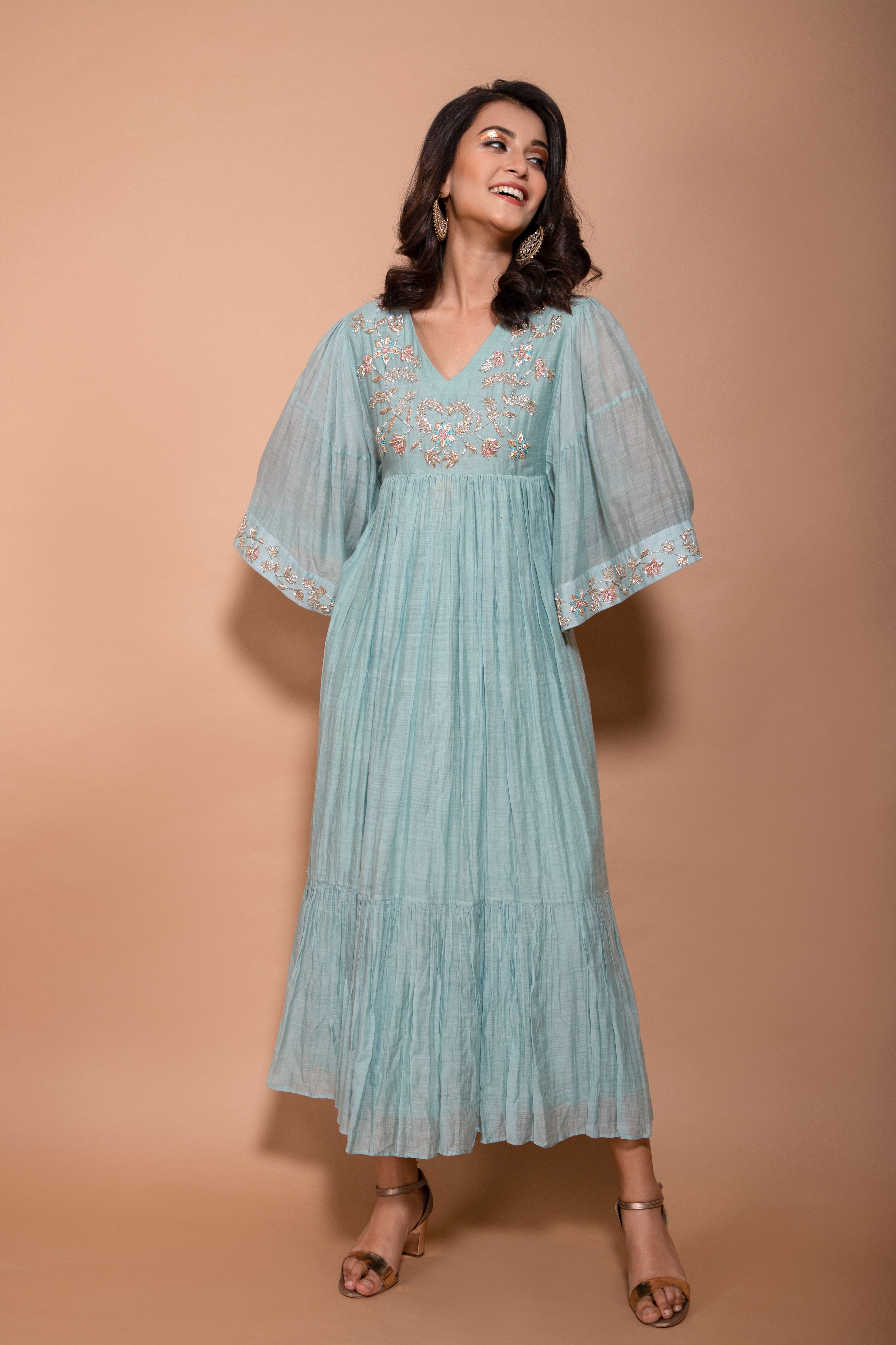 Chandari long dress with work on the yoke and sleeves and it comes with bell sleeves
