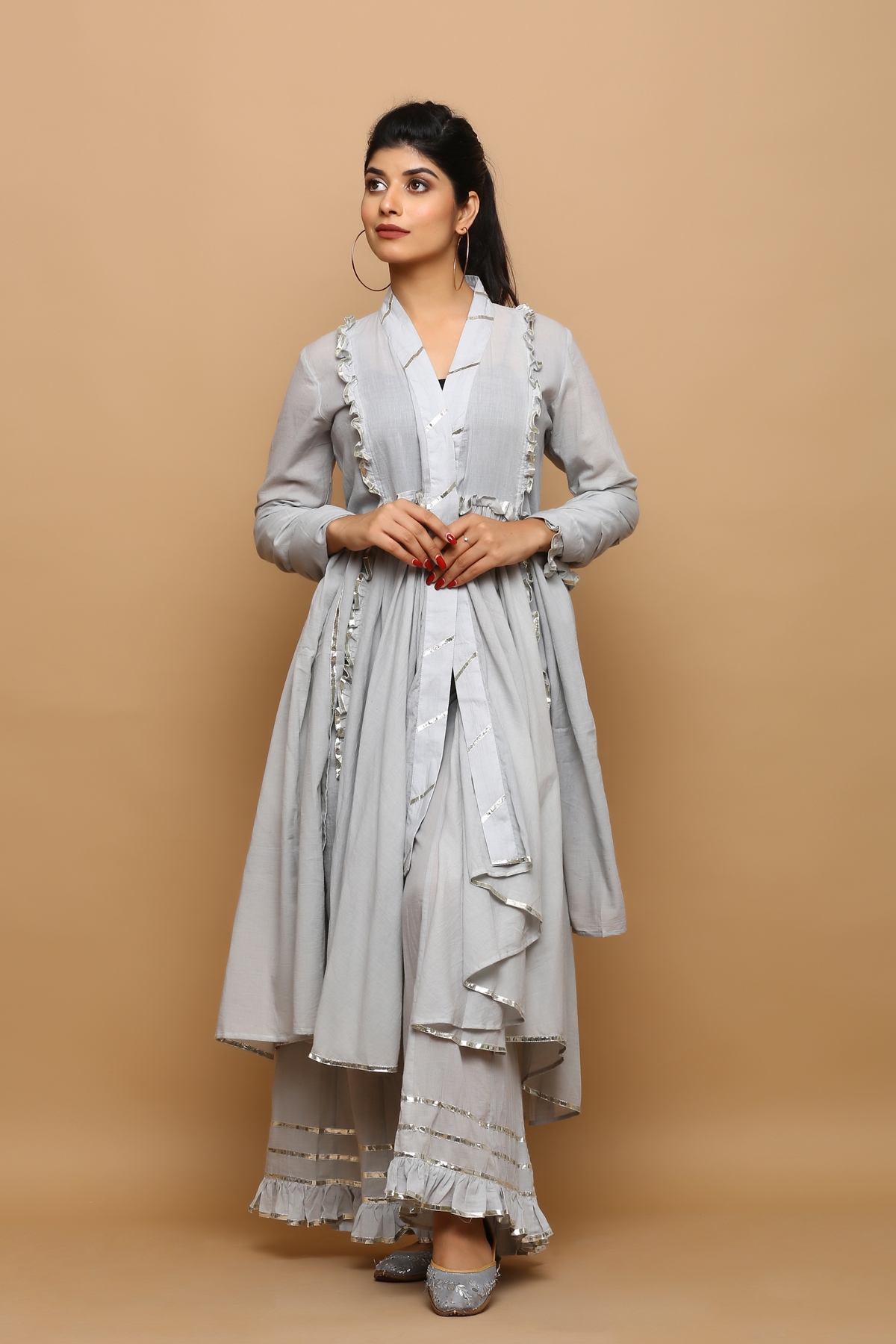Grey a- symmetrical mulmul kurta with flarred palazzo and dupatta and it comes with inner