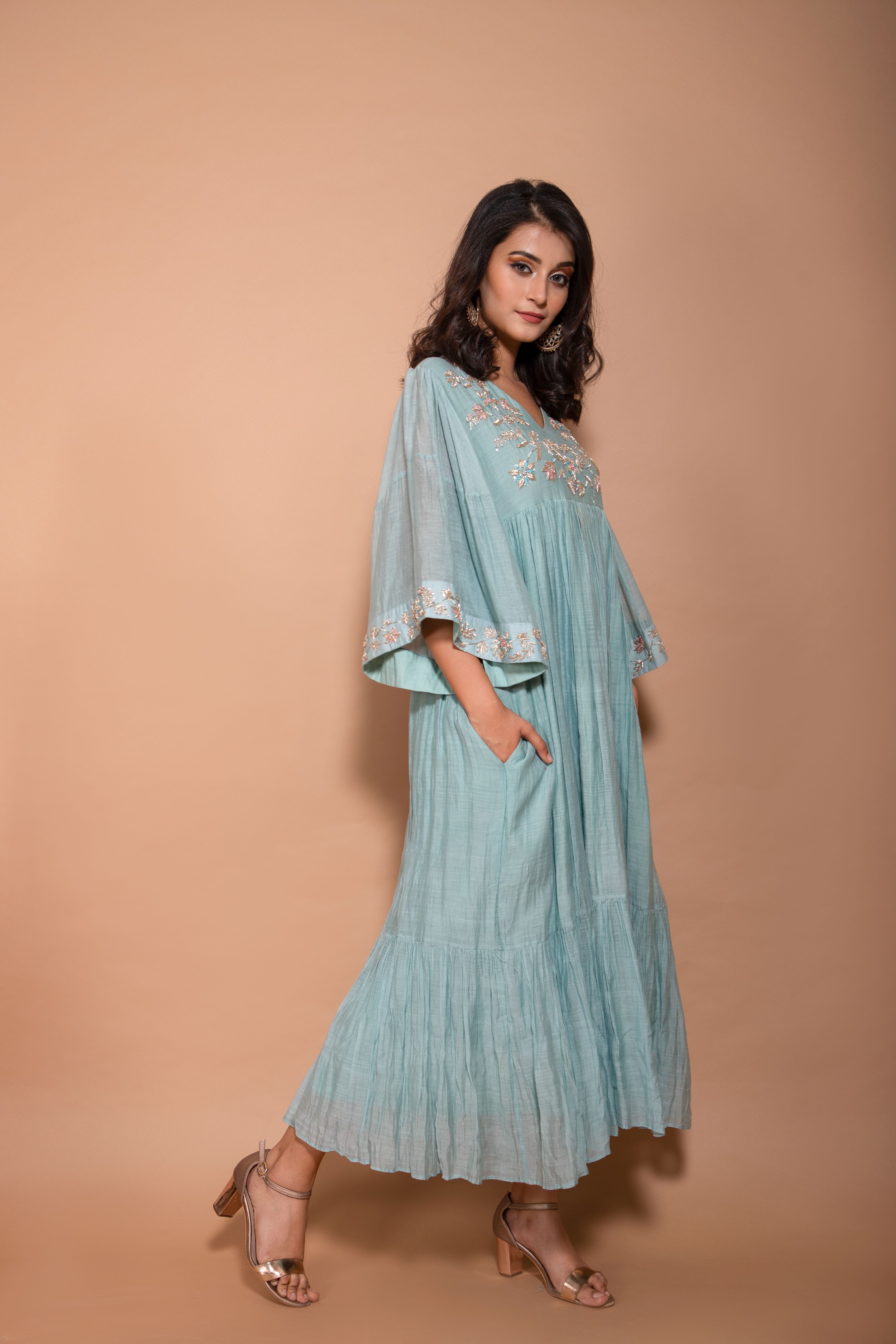 Chandari long dress with work on the yoke and sleeves and it comes with bell sleeves